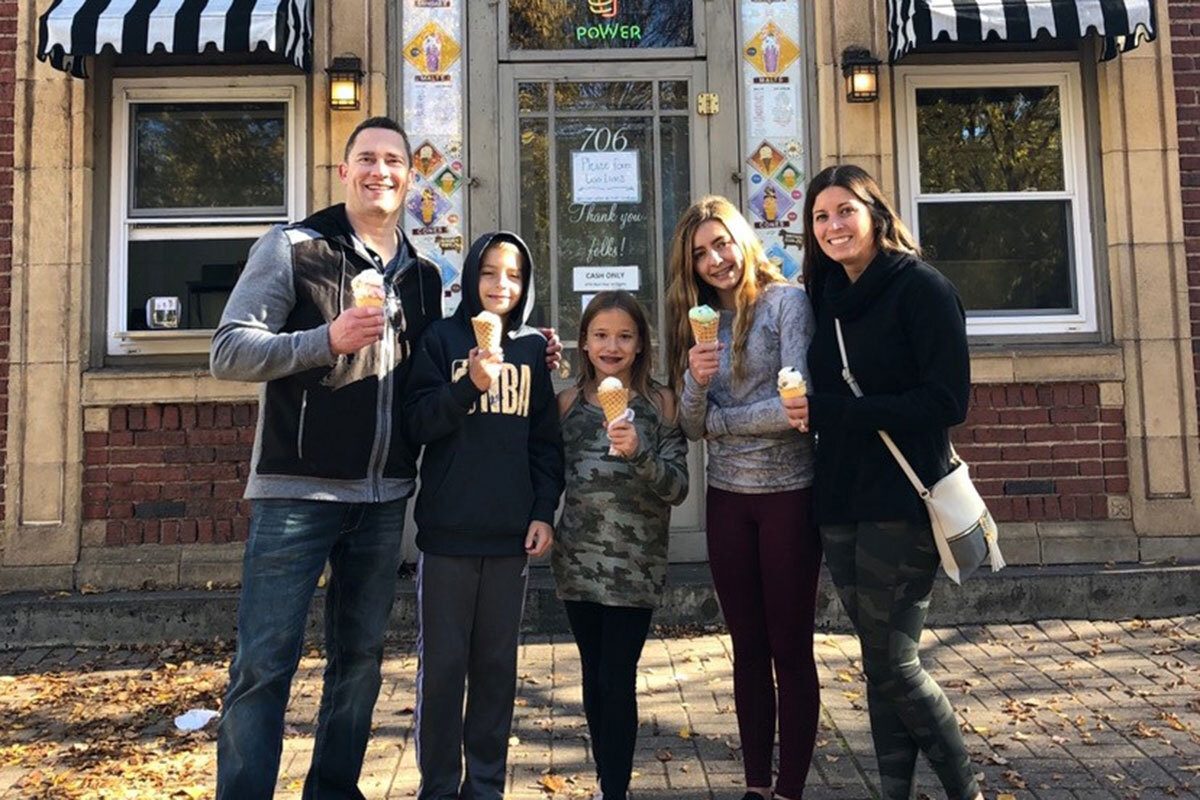 Chris Kellett with his family eating ice cream